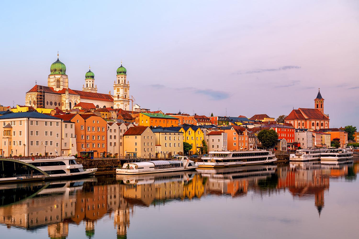 River cruise ship sailing past a European town